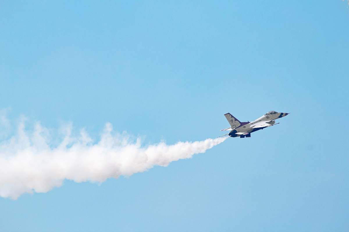 fort mchenry national monument and historic shrine white jet plane in mid air baltimore